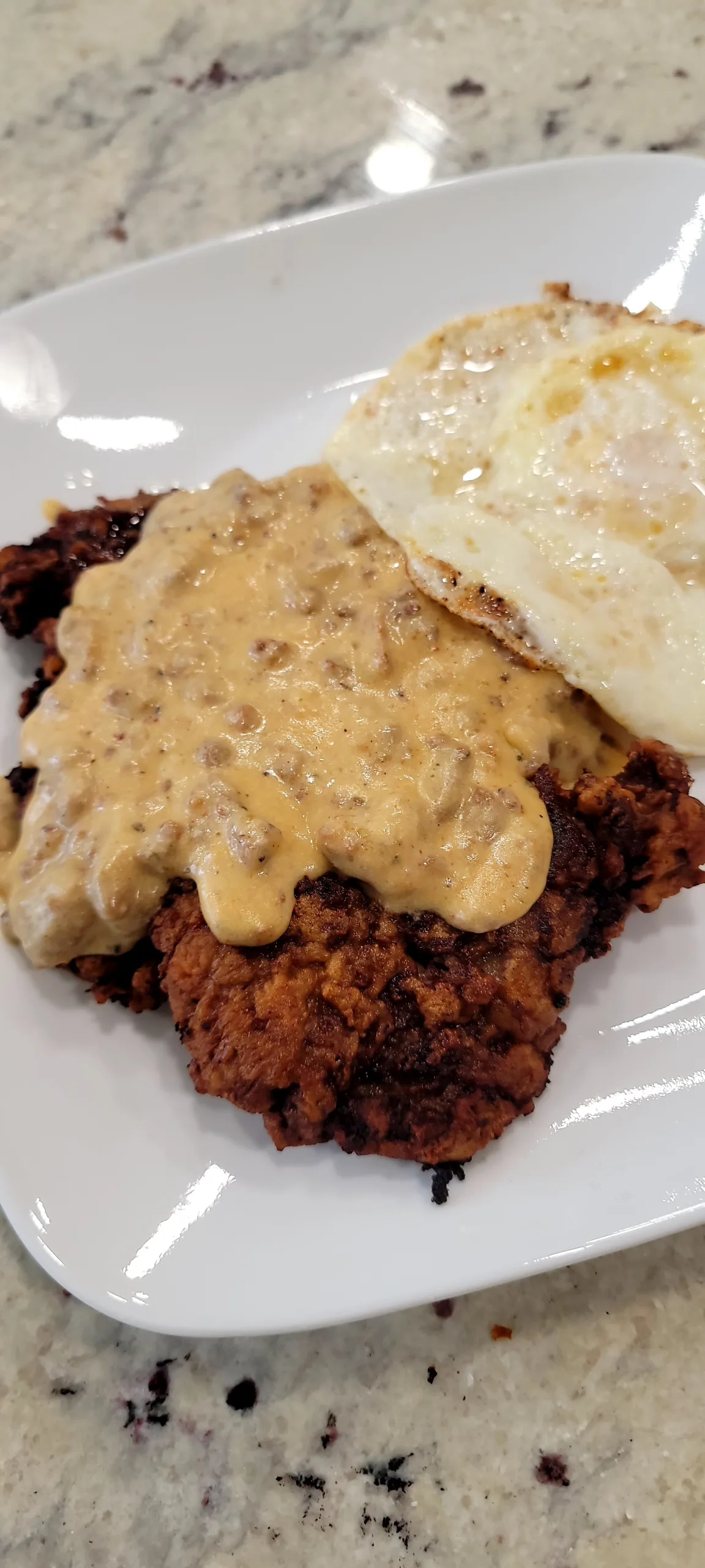 Chicken Fried Steak with Chorizo Sausage Gravy and Fried Eggs